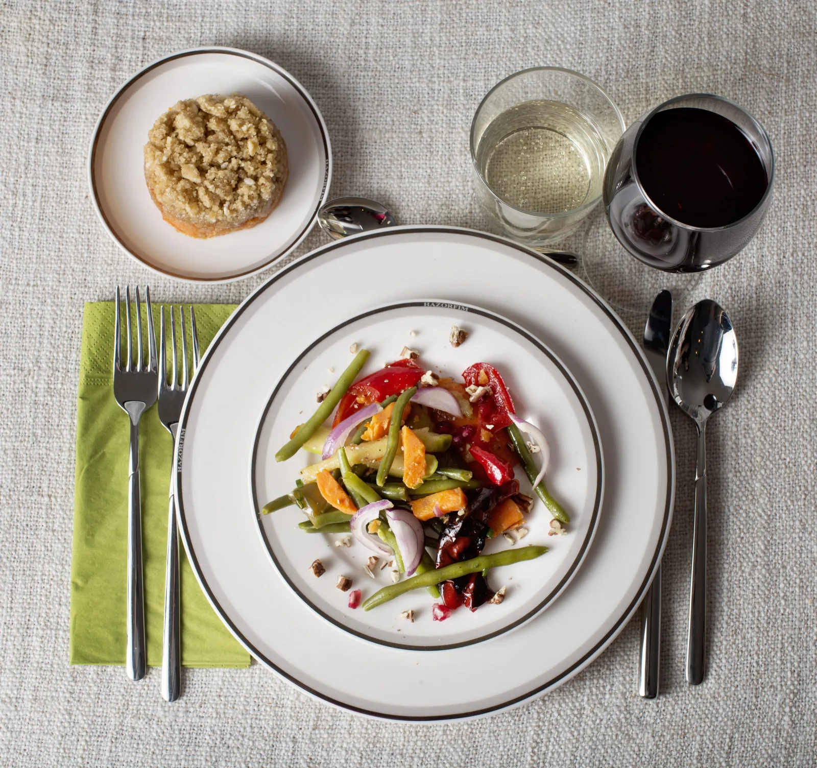 Passover table setting with salad and wine